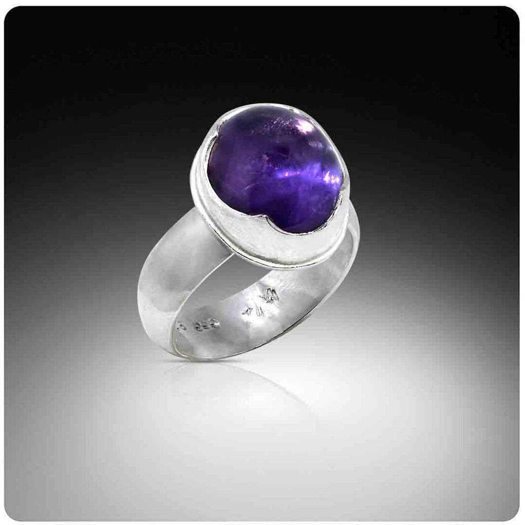 Silver ring with amethyst on a gradient background