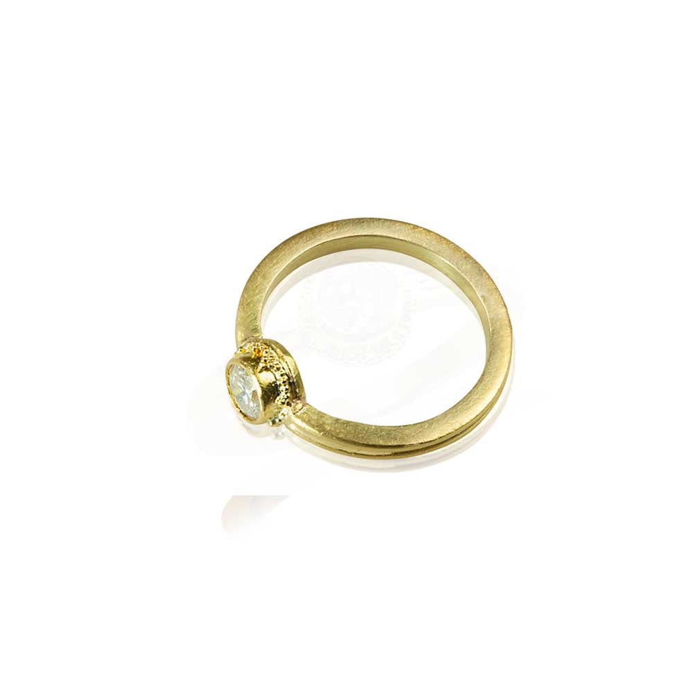 Granulation in 22k gold diamond engagement ring